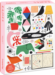 Puzzle box with colorful graphics and 'Eames' branding on a pink background