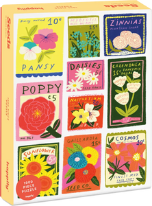 Jigsaw puzzle box with colorful flower seed packet illustrations on a yellow background