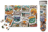 Jigsaw puzzle with national park-themed pieces and a cylindrical packaging tube on a white background